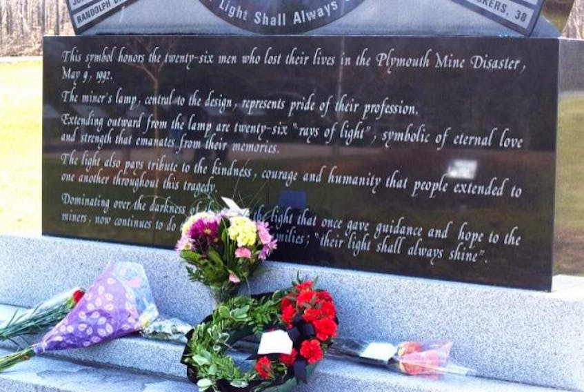 Flowers lie on a monumnet to the miners killed in the Westray Mine explosion on the anniversary of the event.