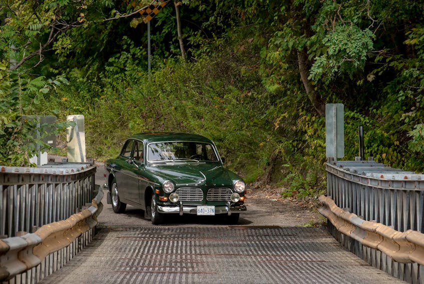 With a degree in history and a passion for heritage, Neville Britto often drives his 1968 Volvo 122S to various historic bridges and buildings around Ontario.  Clayton Seams/Postmedia News