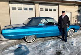 Mike Schmidt picking his 1966 Thunderbird up at the restoration shop on Christmas Eve. Alyn Edwards photo