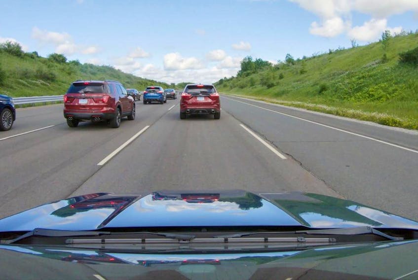 A view of the space between vehicles when vehicles are not using Ford’s adaptive cruise control technology, relying instead on driver reactions to vehicle movements around them.