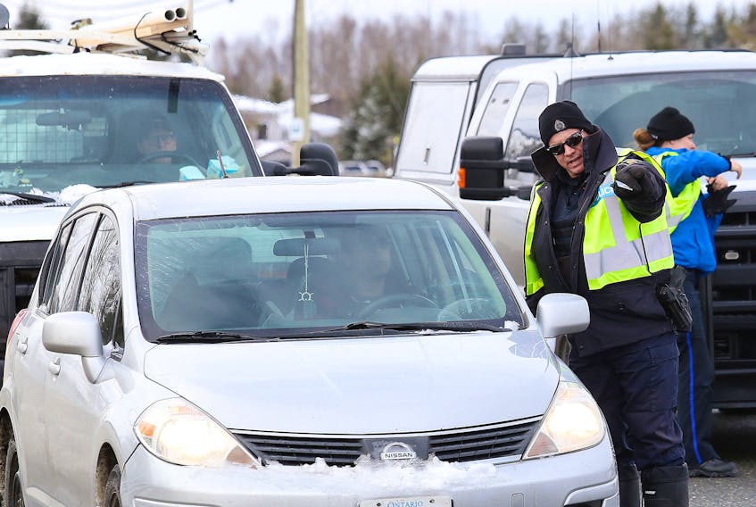 In this file photo, officers from the Greater Sudbury Police and Ontario Provincial Police conduct spot checks on Municipal Road 80. John Lappa / Sudbury Star / Postmedia Network