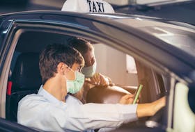 Taxi and Uber drivers still need to carry passengers, so how can they do so most safely. 123rf stock photo