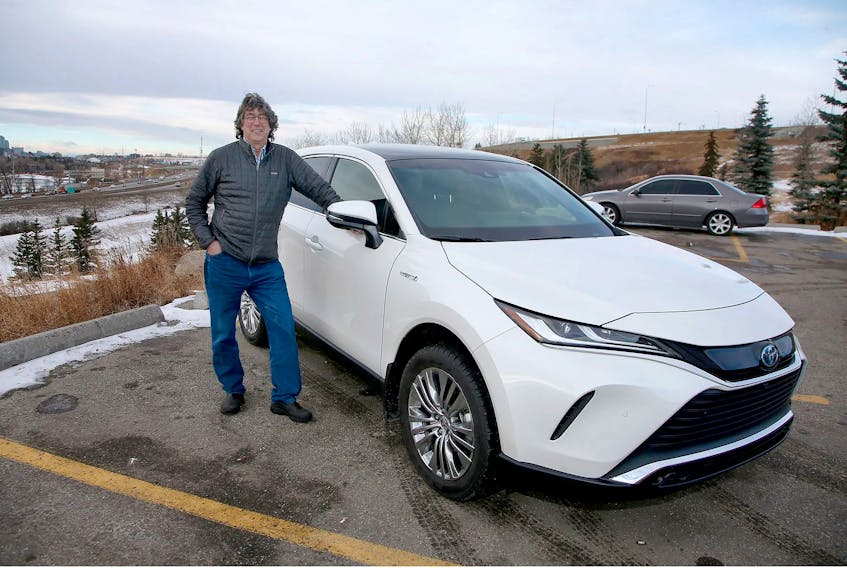 Brian Byl with the 2021 Toyota Venza Limited he drove around Calgary for a week.  Brendan Miller/Postmedia