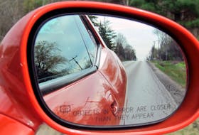 A convex passenger-side mirror with warning. Jil McIntosh/Driving