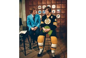 Hockey Night In Canada’s Dave Reynolds, left, and former Boston Bruins star Bobby Orr relax prior to a between-periods interview. In a recent full-page ad newspaper endorsement, Orr said "President Trump has delivered for all the American people, regardless of race, gender, or station in life. That's the kind of teammate I want.”