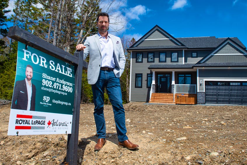 Realtor Shane Anderson poses for a photo in front of one of his listings in the Indigo Shores at McCabe Lake subdivision on Thursday.
Ryan Taplin - The Chronicle Herald