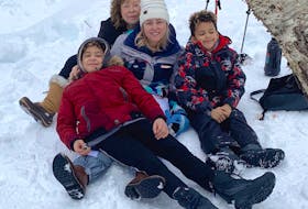 Donna Grover, back, poses for a photo at Uisge Ban Falls Provincial Park with grandsons Rowan, 12, left, and Ambrose, 8, and her daughter Melanie Drummond. Minutes later, Drummond and her stepfather Donnie Bishop were fighting for lives after crashing through the ice into the water seven feet below. Contributed/Donna Grover
