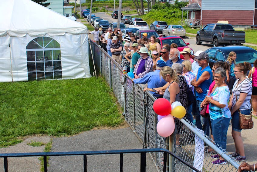People line up near St. Philip’s African Orthodox Church on Hankard Street in Whitney Pier during last year's Caribbean Festival. Tthe festival, which started in 1985, won’t take place this year because of the COVID-19 pandemic. Cape Breton Post photo