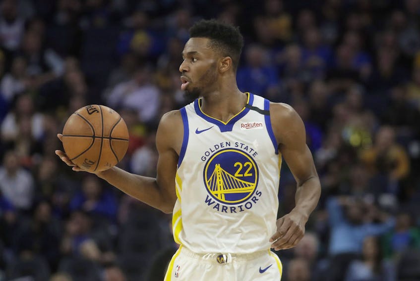 Golden State Warriors guard Andrew Wiggins dribbles the ball during a game in February. Wiggins told Sun sportswriter Ryan Wolstat that he's loving life in the Bay Area and with the Warriors. (Jeff Chiu/The Associated Press)