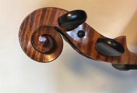 This is an example of the scrollwork typical of violins made by William Wallace. - Contributed