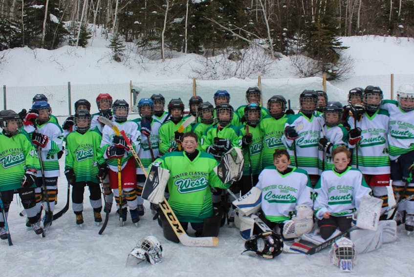 The Cape Breton County Islanders and Cape Breton West Islanders Atom 'A' hockey teams took part in the Winter Classic game at the Ingonish Outdoor Rink on Feb. 16. The teams wore special winter classic jerseys during the game. The score was not provided. CONTRIBUTED/JANICE SMITH-CUNNINGHAM
