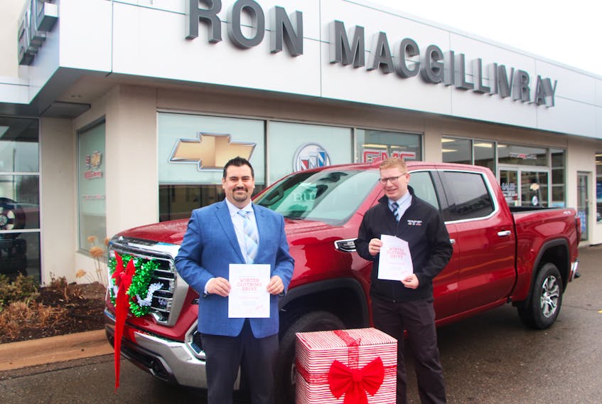 Ron MacGillivray Chevrolet Buick GMC is one of the drop-off sites for a winter clothing drive, presented by Family Service of Eastern Nova Scotia, which goes until Dec. 22. The People’s Place Library and the family services office, both on Main Street, are other drop-off location for donations and the dealership, represented in the photo by Michael Hart and Dave MacGillivray, are also making a monetary donation with every vehicle sold during the campaign.