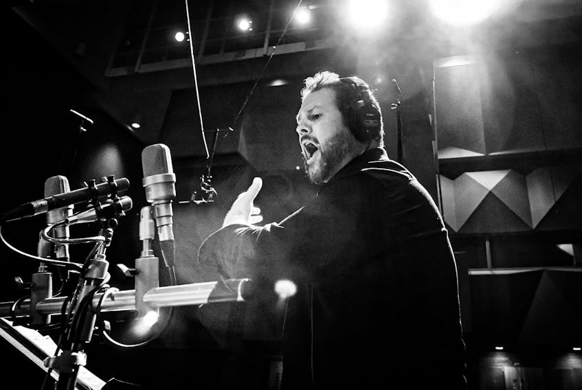 Opera singer David Pomeroy is shown recording a selection from his upcoming debut solo album with the Newfoundland Symphony Orchestra in St. Johns last month. Photo by Greg Locke. - Contributed