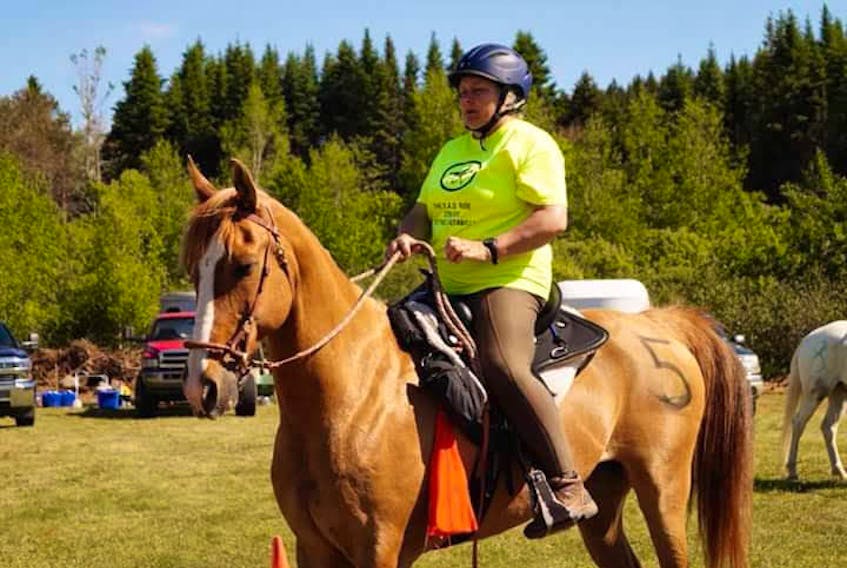 Donna Lee, president of the P.E.I. Trail Riders, rides her horse, Bohannon.
