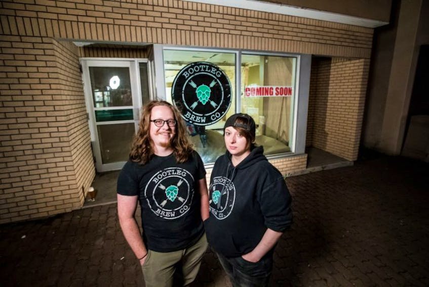 Matt Tilley and Morgan Turner-Crocker are seen outside the building that will house their Bootleg Brew Co. on West Street in Corner Brook.