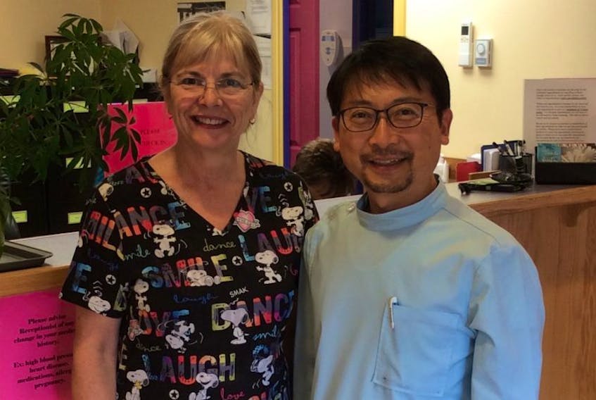 Norris Point dentist, Dr. Marina Sexton, poses for a photo in her clinic with Ji Hwan Kim, the area's new dentist.