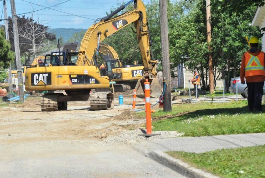 Excavators are seen working on St. Clare Avenue as reconstruction of a section of that road continues.