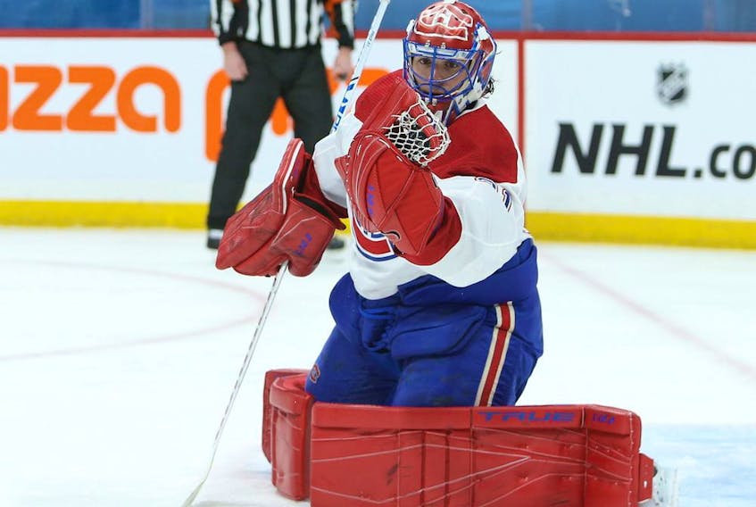 Montreal Canadiens goaltender Carey Price snags a Winnipeg Jets shot in Winnipeg Feb. 25, 2021. 