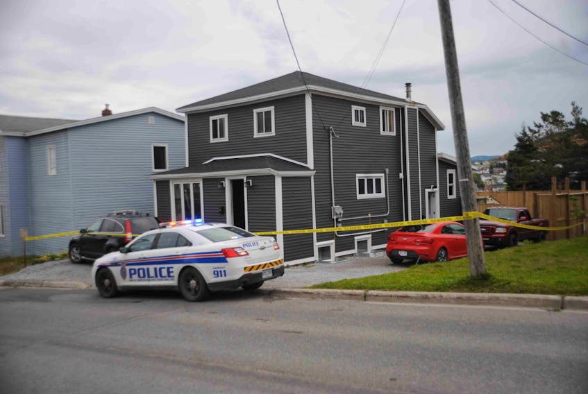 A Royal Newfoundland Constabulary cruiser is stationed outside this house on Country Road in Corner Brook where four people were evacuated after fire broke out early Tuesday morning.