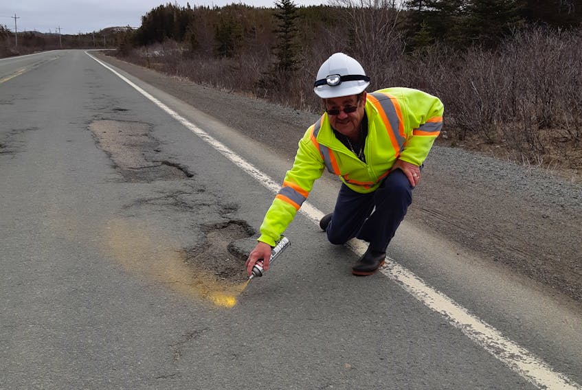 Ernest Barnes, aka Pothole Man, is once again keeping a watchful eye on the roadways of Notre Dame Bay. For the past few years the Summerford senior has been spray painting potholes to serve as a warning to motorists. PHOTO COURTESY OF DAVID BOYD