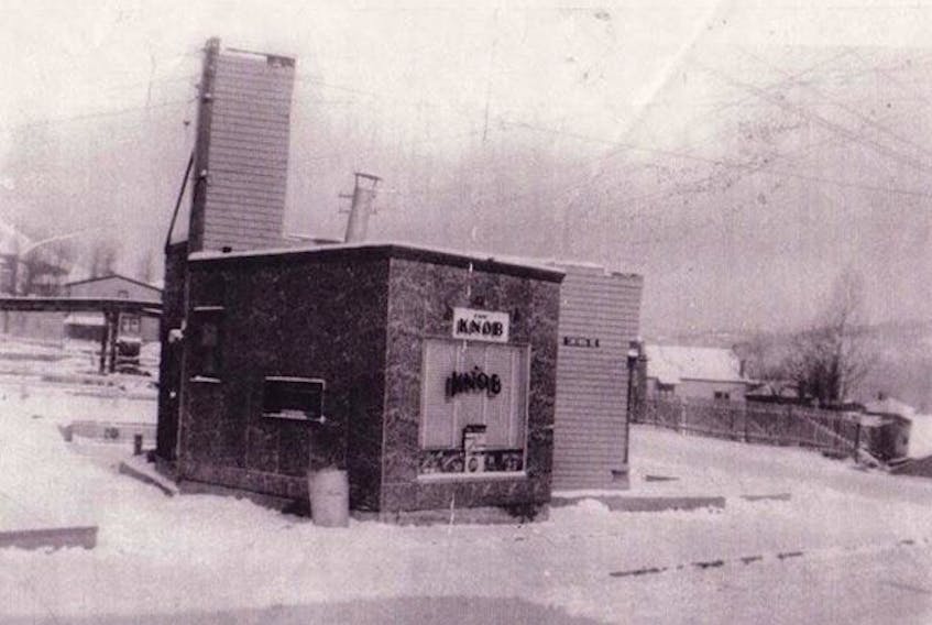 The Knob, one of the few businesses that survived the fire on Broadway in 1952, stands with the devastated business district in Corner Brook behind it.