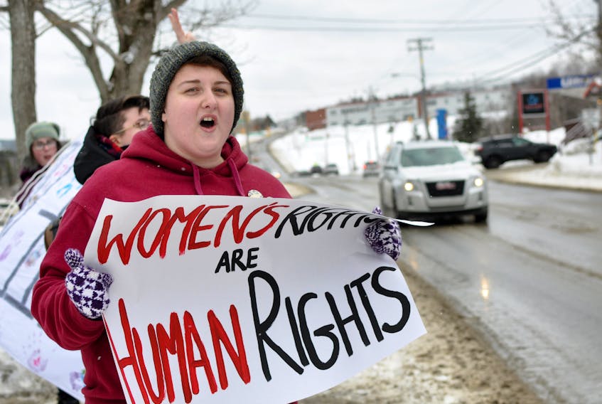 Protester Tiffany Roberts held a sign proclaiming “Women’s rights are human rights” outside the Corner Brook courthouse Thursday as part of a protest over the sentence given to Robert Hicks for assaulting a woman.