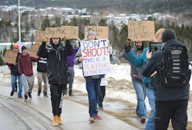Demonstrators demanding answers about the circumstances under which Jorden McKay was shot by the police in Corner Brook last week march towards the Royal Newfoundland Constabulary headquarters Monday afternoon. Around 20 people took part in the hour-long event. McKay, 27, died after RNC officers went to his home late last Tuesday night. The Ontario Provincial Police are conducting an investigation into what happened.