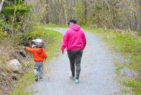 Kelly Hann and her son, four-year-old Elliott O'Dell, enjoy a walk on the ParticiPark trail in Corner Brook Wednesday.