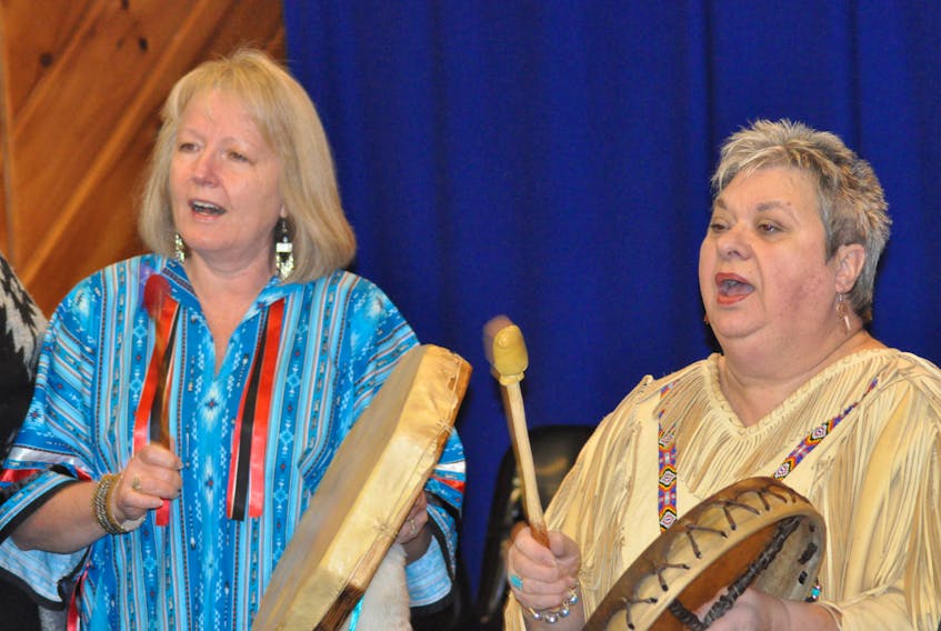 Mary White, left and Phyllis Cooper were two of the Mi’kmaq drummers who performed “The Healing Song” during somber ceremonies at the Day of Remembrance and Action on Violence Against Women in Stephenville on Wednesday.