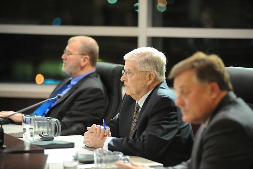 Coun. Bernd Staeben, centre, listens to a city council discussion after presenting Corner Brook’s budget for 2019 at city hall Monday evening. On the left is Coun. Tony Buckle, while Coun. Josh Carey sits on the right.