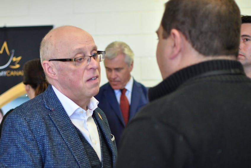 Health Minister John Haggie spoke with Corner Brook Mayor Jim Parsons following an event at Academy Canada on Thursday.