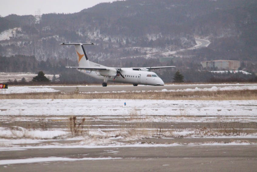 The crippled Provincial Airlines plane that was nose down at the Stephenville airport runway after making an emergency landing at noon hour with 47 passengers on board is seen here.