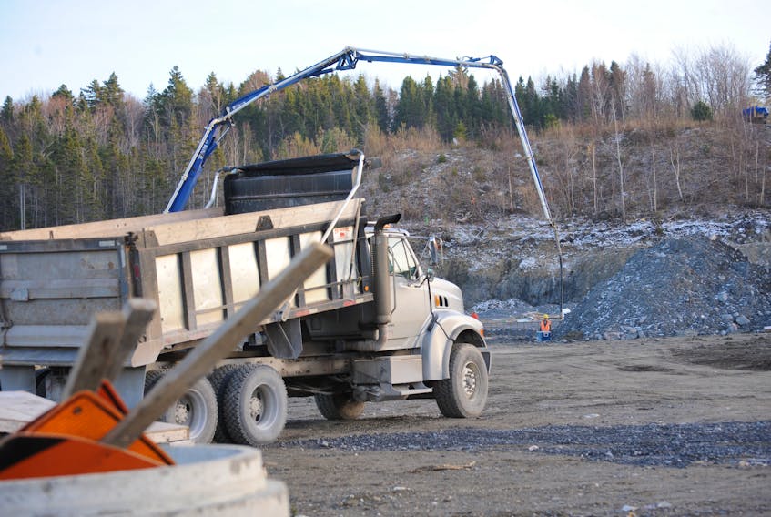 A contractor pours concrete Thursday for the foundation of what will be a new hotel on Grenfell Drive in Corner Brook.