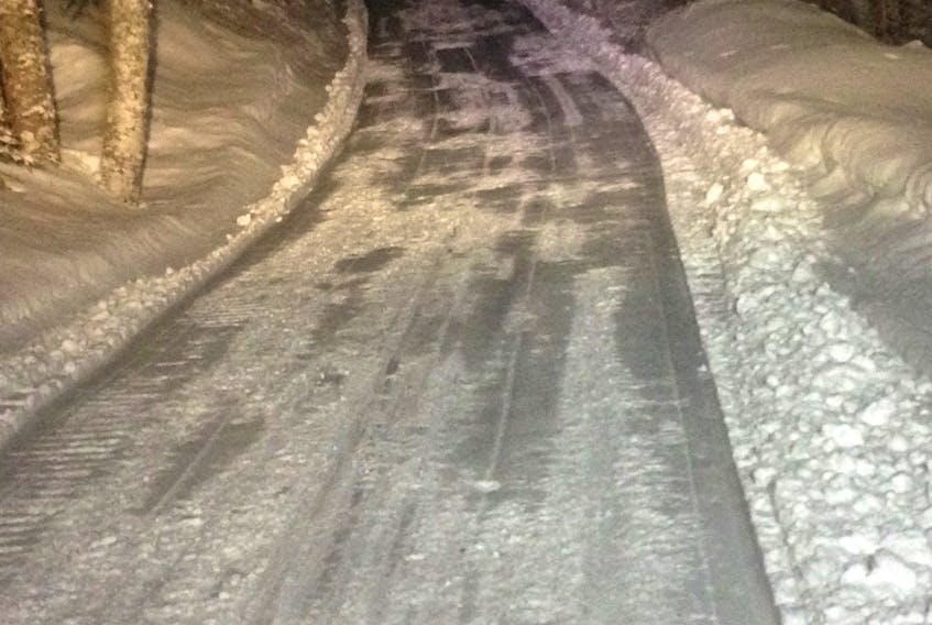 The Cold Brook Road trail being groomed at night by the Bay St. George Snowmobiling Association.