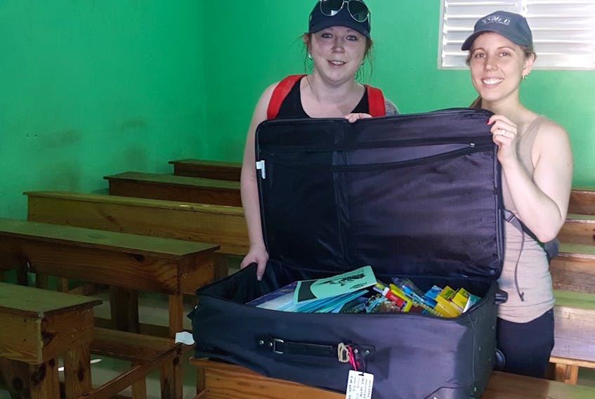 Photo courtesy of Allison Power
Janice Dolland, left, and Allison Power brought this suitcase full of supplies to the Ecole L'Union in Calvaire, Haiti.