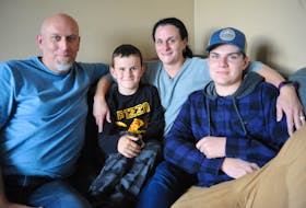 Tracy and Mark Vaters of Corner Brook, posing here for a photo with their sons, six-year-old Kyle Vaters and 14-year-old Mitchell Prosper, will be doing their seventh Red Shoe Crew Walk for Families in Irishtown-Summerside this weekend.
