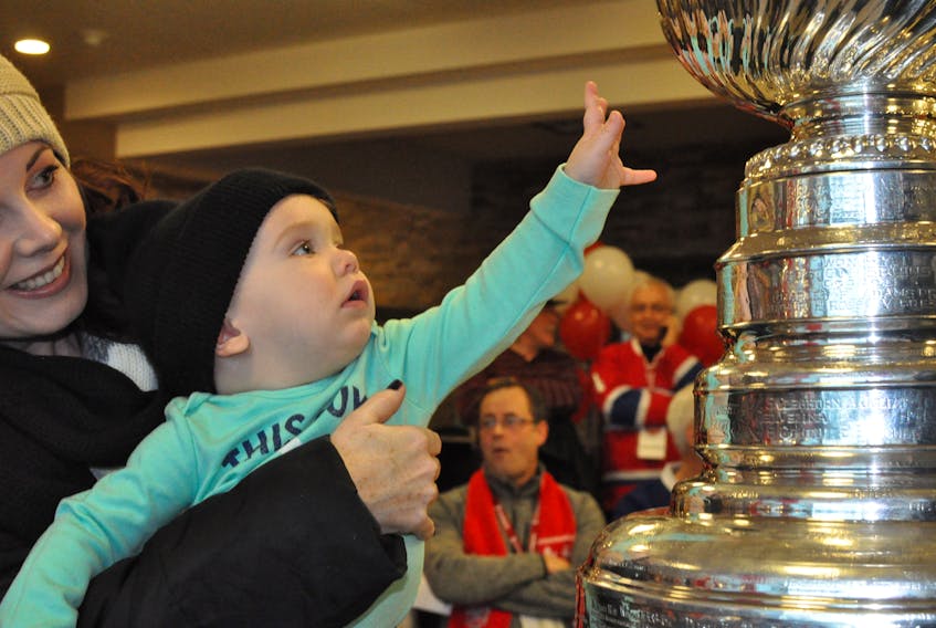 One-year-old Jaxson Mayzik was in awe when his aunt Aimee House put him up next to the Stanley Cup at Corner Brook City Hall on Saturday morning during the opening ceremony for Scotiabank Hockey Day in Canada.