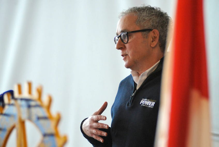Peter Alteen, the president and chief executive officer of Newfoundland Power, addresses Rotary Club of Corner Brook members in his hometown Thursday.
