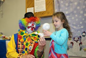 Andrew Aylward photo
Schtappy the Clown presents Rachel Young with a balloon animal at the Winter Carnival closing ceremony on Sunday.