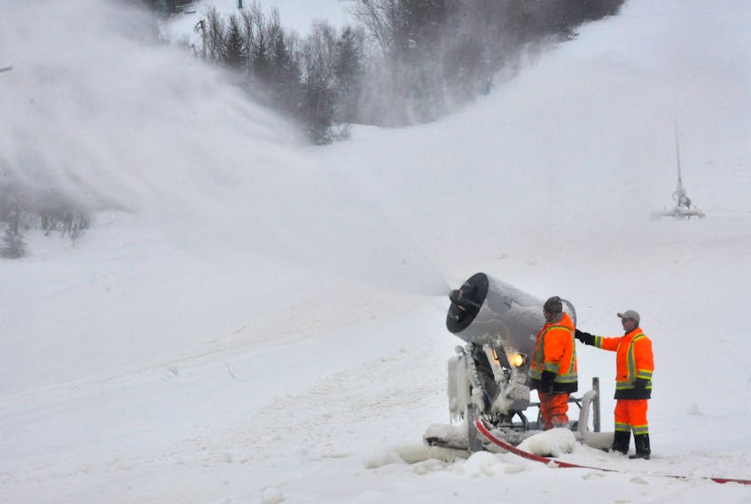 Workers at Marble Mountain ski resort check out the snowguns at the base of the hill Thursday morning. Marble management hope to have the Chilliwack open on Jan. 2.