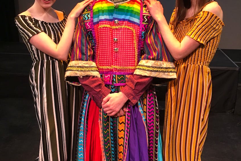 Simon Boitsefski plays the lead in “Joseph and the Amazing Technicolour Dreamcoat” this week at the Corner Brook Arts and Culture Centre. He poses here with narrators Sadie MacDonnell, left, and Claire Coleman.