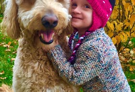 Sarah and Michael Short of Deer Lake have set up the Islaview Foundation in honour their daughter Isla. Isla Short, who died of cancer this past November, is seen here with the family's dog Ryder.