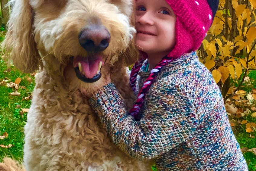 Sarah and Michael Short of Deer Lake have set up the Islaview Foundation in honour their daughter Isla. Isla Short, who died of cancer this past November, is seen here with the family's dog Ryder.