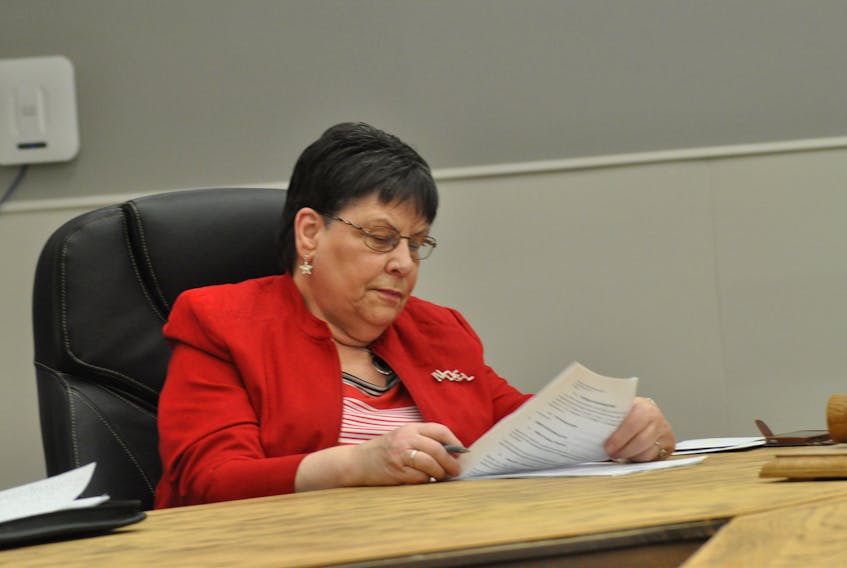 Coun. Laura Aylward checks out some items on the agenda at Thursday’s regular general meeting of the Stephenville town council.