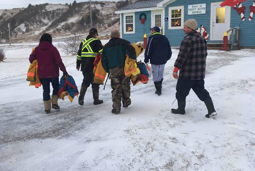 This picture being shared on Facebook shows unidentified members of the Trout River Volunteer Fire Department headed to the town office to turn in their bunker gear. The members resigned to show their support for former fire chief Ralph Traverse, who was removed from the position by the town’s council earlier this month.