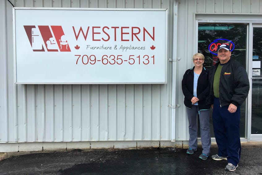 Owners Kathy and Jerry Langdon pose for a photo outside of Western Furniture and Appliances in Deer Lake.