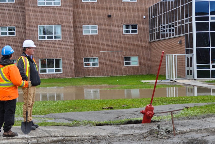 A water line break in the area of this fire hydrant outside Grenfell Campus sent water, sand and rocks flowing over the top of University Drive in Corner Brook on Wednesday afternoon.