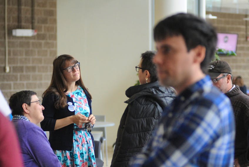 People chat during an information session at Grenfell Campus, Memorial University in Corner Brook Thursday afternoon to draw awareness of working conditions for per-course instructors throughout the university.