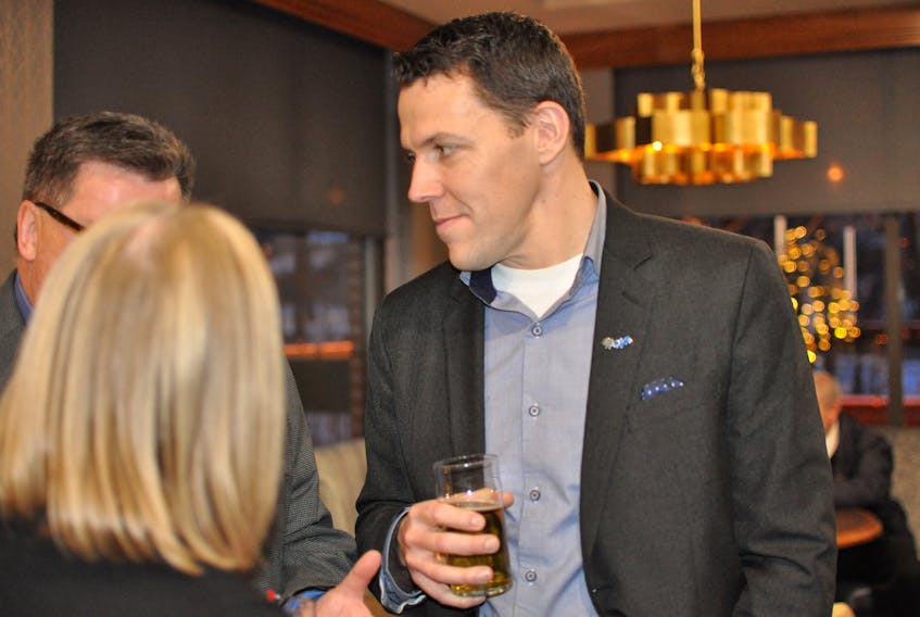 The Greater Corner Brook Board of Trade hosted its annual Christmas reception at the Glynmill Inn Lounge on Tuesday. Jason Hillyard of CPA Newfoundland and Labrador is seen here chatting with some of the other attendees.