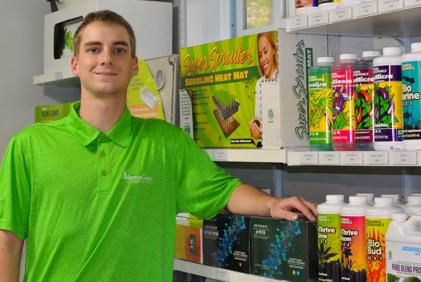 Devon Pardy poses for a picture inside his new HomeGrow Experts NL, an indoor gardening and hydroponics store in Corner Brook.